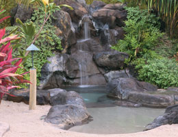 lagoon hot tub with waterfall at the main pool